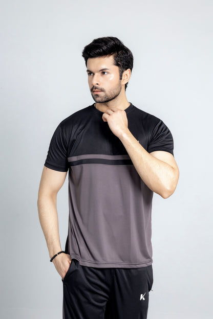 "CoalCore tracksuit close up charcoal fabric texture KLYRO"