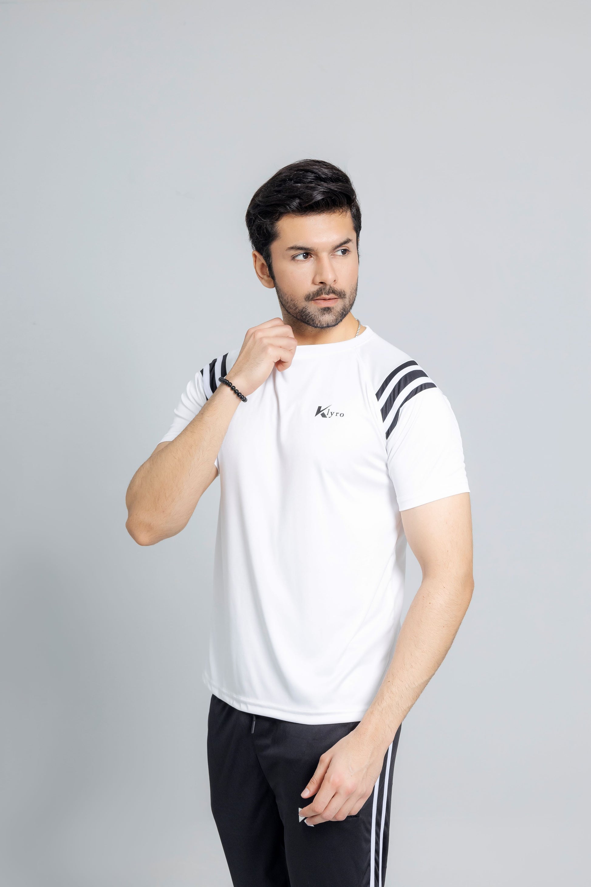 "White Eagle tracksuit close up fabric texture detail KLYRO"